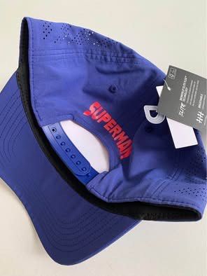 Bioworld Elite Flex Superman Baseball Cap OSFM Blue (Category: Caps & Hats) located in Agdangan. Submitted by rarefinds.box (Listing ID 1459976613, Image 2). Description: - Iconic blue Superman logo on the front - Brand: Bioworld, Elite Flex line - Size: One Size Fits Most (OSFM) - Features perforated sides for enhanced breathability - Adjustable snapback closure for a custom fit - 'SUPERMAN' text embroidered on the back - A must-have for any Sup