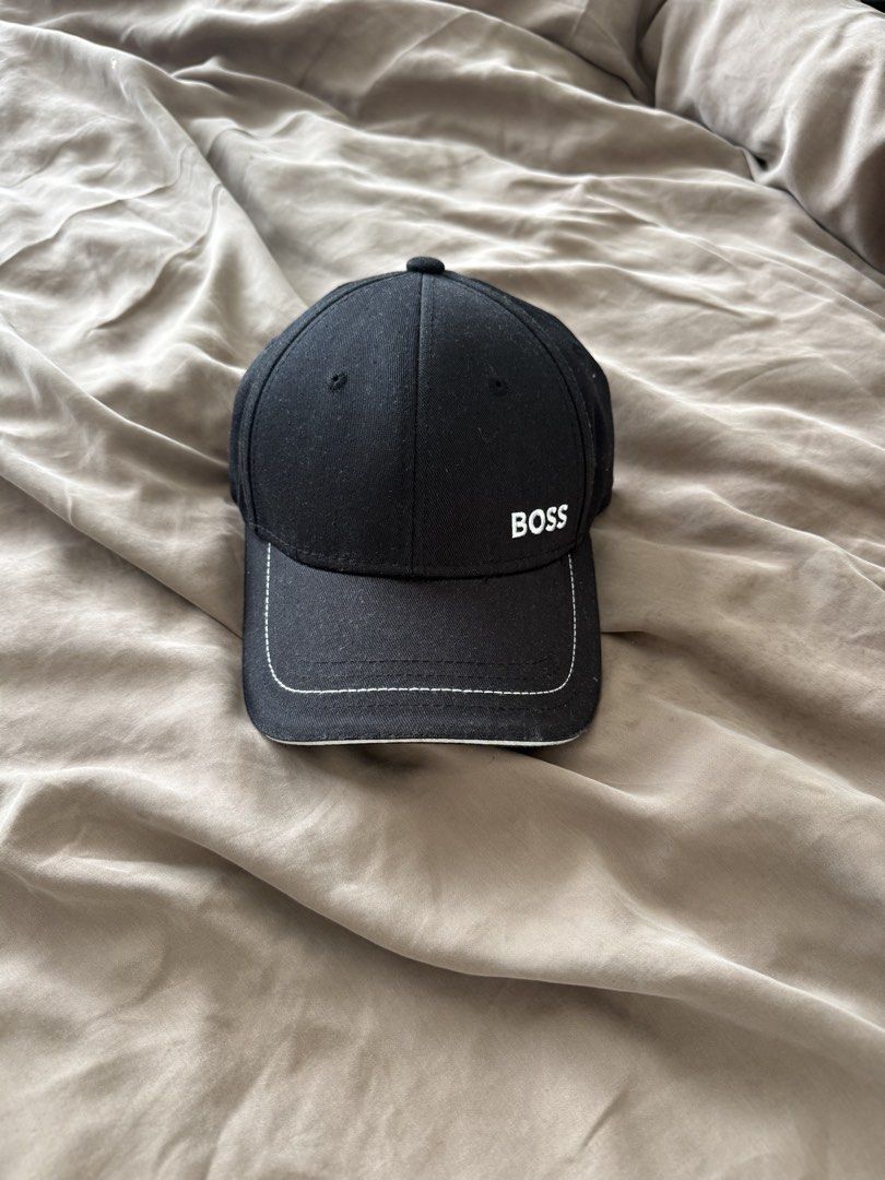Black BOSS Cap (Category: Caps & Hats) located in Cebu City. Submitted by takeitfrom.me (Listing ID 1459945344, Image 1). Description: - Classic black BOSS cap - Embroidered BOSS logo on the front - White stitching detail along the brim - Simple and stylish design - Great for everyday wear.