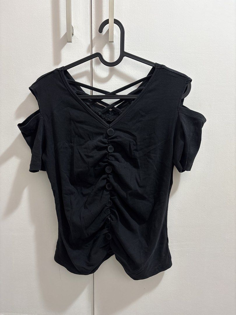 Black Cold Shoulder Ruched Button-Up Top (Category: Blouses) located in Caloocan City. Submitted by preloved_tiffanyycollects (Listing ID 1460104219, Image 1). Description: - Black cold shoulder top - Ruched detailing down the front - Criss-cross strap detail at the back - Button closures - Short sleeves - Versatile for casual or night out looks - Pairs well with jeans or skirts.