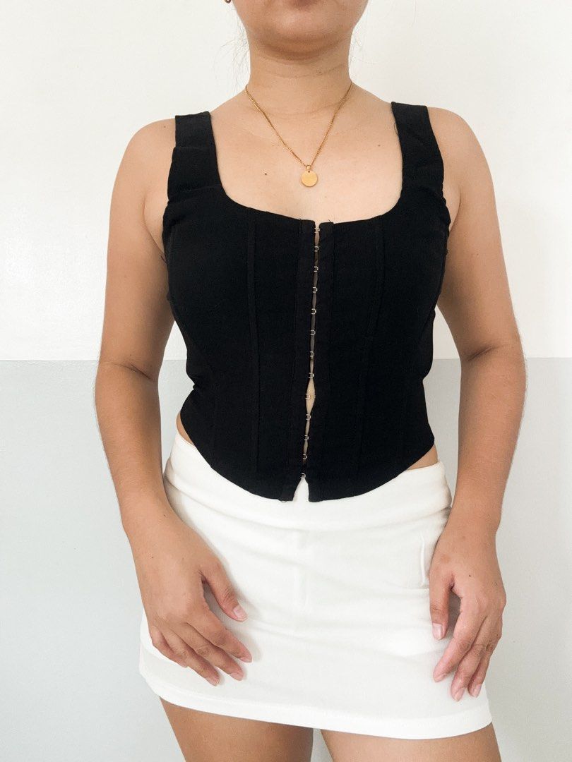 Black Corset Top with Hook and Eye Closure (Category: Others Tops) located in Maasin. Submitted by yemashop (Listing ID 1459958766, Image 1). Description: RFS: Decluttering FREE SHIPPING!!! - Black corset top - Square neckline - Front hook and eye closure - Fitted silhouette - Versatile: pairs well with skirts or trousers.