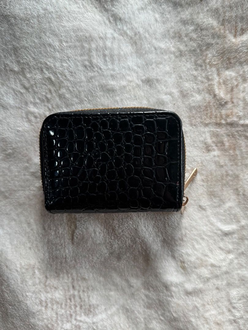 Black Croc Zip Around Card Holder Wallet (Category: Wallets & Card holders) located in Caloocan City. Submitted by eogg30 (Listing ID 1460075649, Image 3). Description: - Sleek black card holder with elegant croc texture. - Secure zip-around closure. - Multiple internal card slots for organization. - Stylish gold hardware accents. - Compact design, perfect for pockets and small bags..