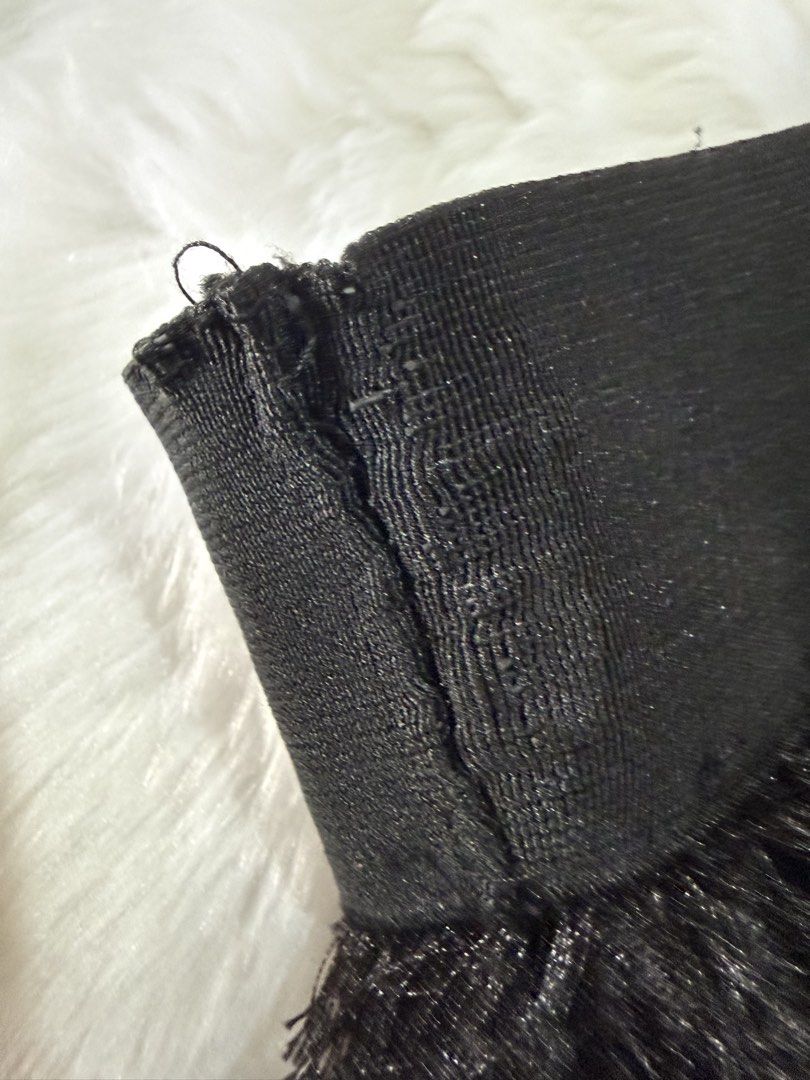 Black Feather Tassel Midi Skirt (Category: Skirts) located in Quezon City. Submitted by jezjewels.ph (Listing ID 1459979494, Image 2). Description: - Chic black midi skirt - Features a playful feather tassel texture - Comfortable elastic waistband - Mid-calf length - Ideal for parties, nights out, or making a statement.