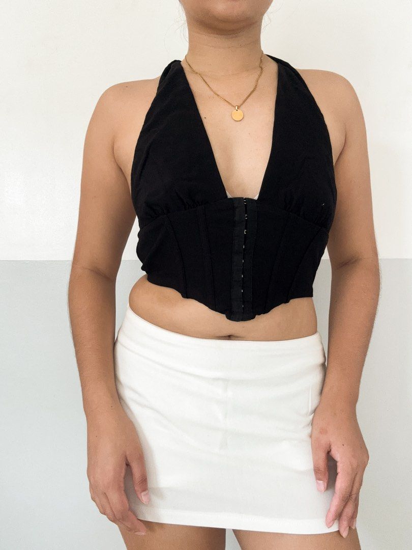 Black Halter Neck Corset Top with Hook and Eye Closure (Category: Sleeveless) located in Maasin. Submitted by yemashop (Listing ID 1459963012, Image 1). Description: RFS: Decluttering FREE SHIPPING!!! - Black halter neck corset top - Deep V-neckline - Front hook and eye closure - Fitted bodice with boning details - Perfect for dressing up or down - Style with skirts or jeans.