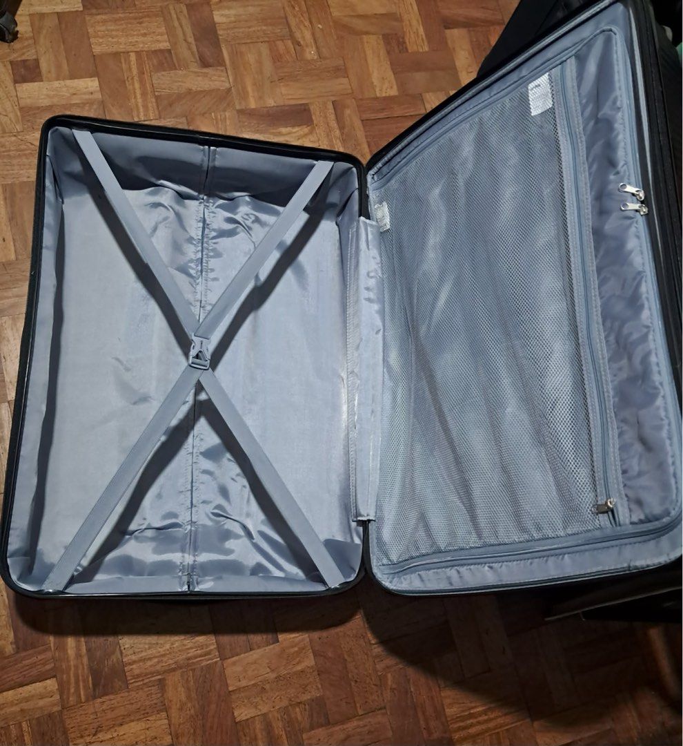 Black Hardshell Spinner Luggage with TSA Lock (Category: Luggage) located in Muntinlupa City. Submitted by caseypeech (Listing ID 1459981902, Image 3). Description: - Durable black hardshell spinner luggage - Built-in TSA combination lock for security - Interior straps to keep belongings in place - Zippered mesh compartment for organization - Smooth rolling wheels for effortless travel.
