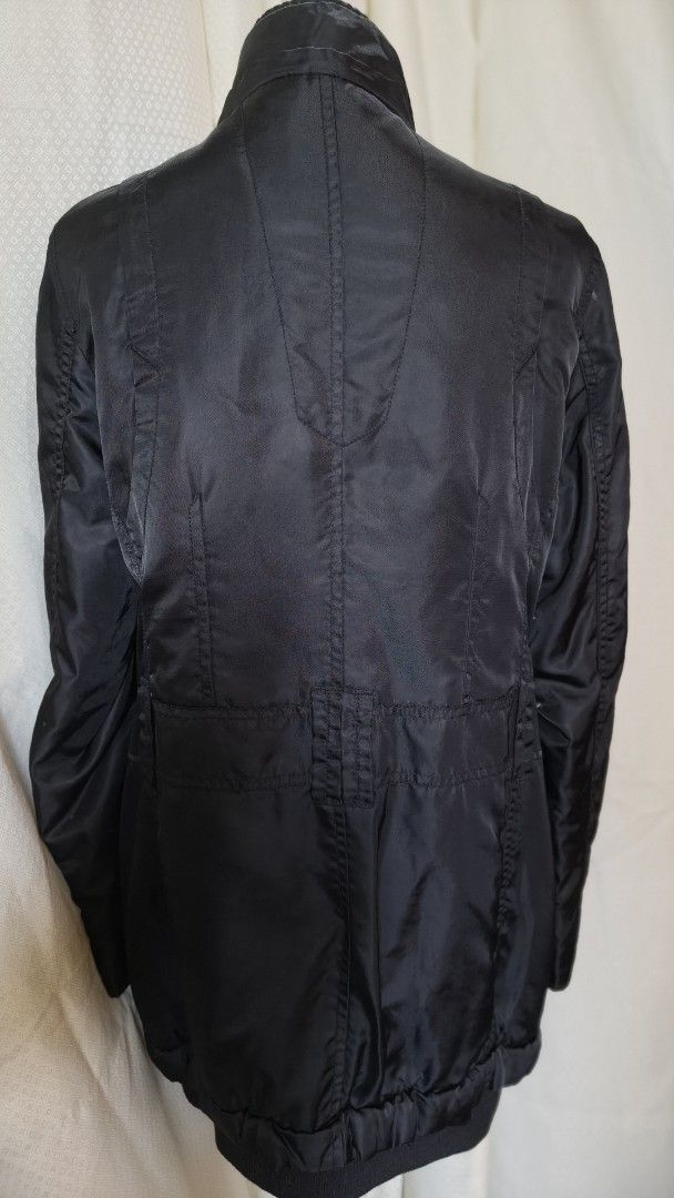 Black Jacket with Multiple Zippers and Pockets (Category: Coats, Jackets and Outerwear) located in Taguig. Submitted by ymicloset (Listing ID 1459956684, Image 2). Description: - Stylish black jacket with an edgy look. - Multiple zippered pockets on the front for secure storage. - Additional button pockets and unique ring details. - Stand-up collar with a comfortable ribbed trim. - Full zipper closure down the front. - Versatile for layering or w