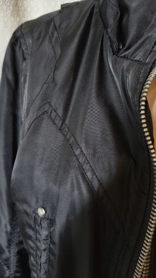 Black Jacket with Multiple Zippers and Pockets (Category: Coats, Jackets and Outerwear) located in Taguig. Submitted by ymicloset (Listing ID 1459956684, Image 3). Description: - Stylish black jacket with an edgy look. - Multiple zippered pockets on the front for secure storage. - Additional button pockets and unique ring details. - Stand-up collar with a comfortable ribbed trim. - Full zipper closure down the front. - Versatile for layering or w