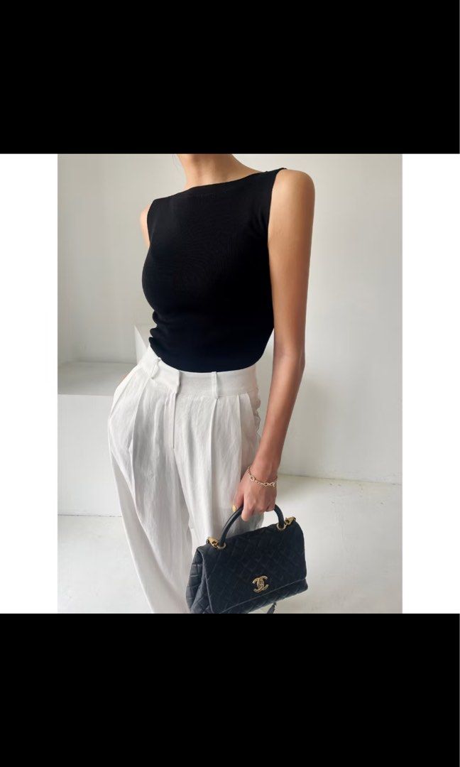 Black knit sleeveless top (Category: Sleeveless) located in Quezon City. Submitted by clothe.kr (Listing ID 1460046710, Image 1). Description: .