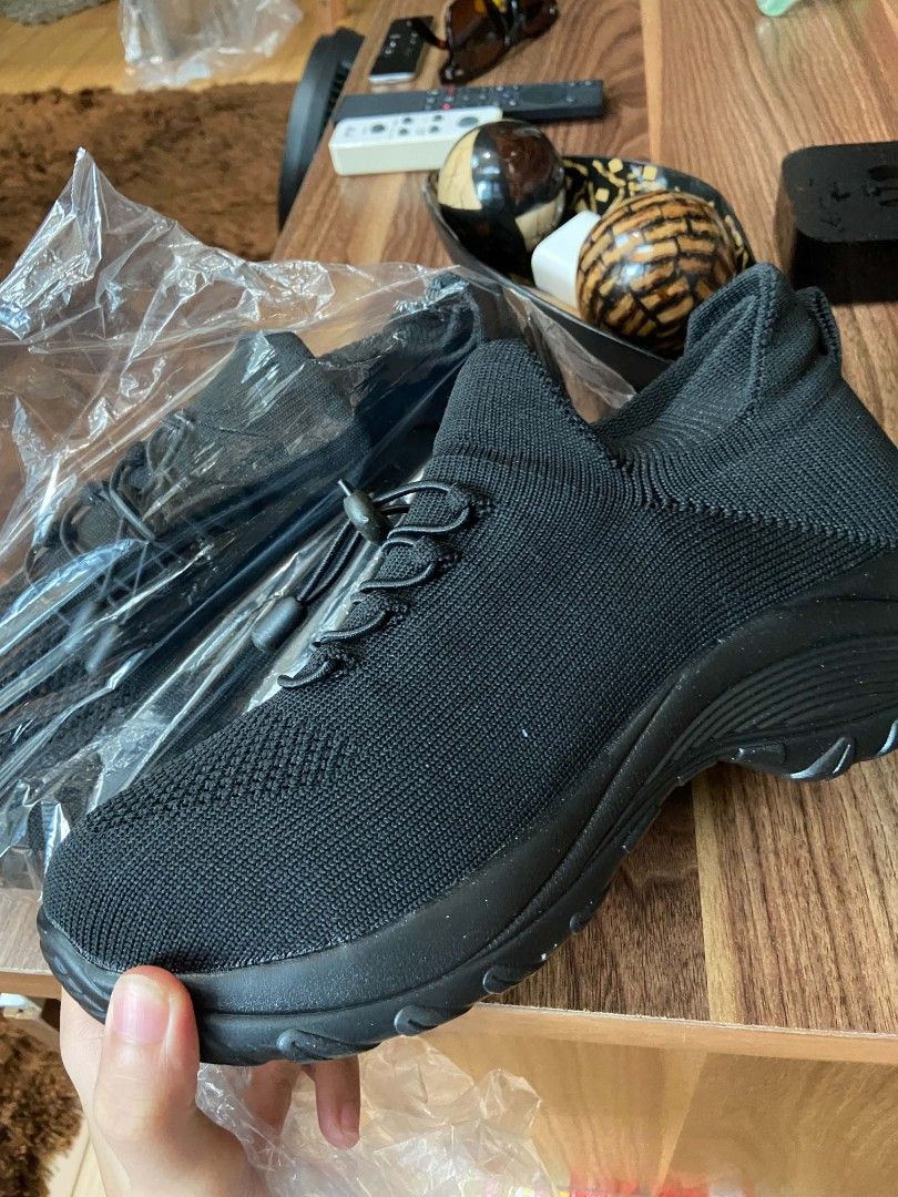 Black Knit Slip-On Sneakers with Drawstring Laces (Category: Sneakers) located in Taguig. Submitted by lun3er_ (Listing ID 1460002242, Image 1). Description: - Black knit sneakers - Easy slip-on style - Adjustable drawstring laces for a secure fit - Comfortable sole - Ideal for everyday wear or light exercise - Comes in original packaging.