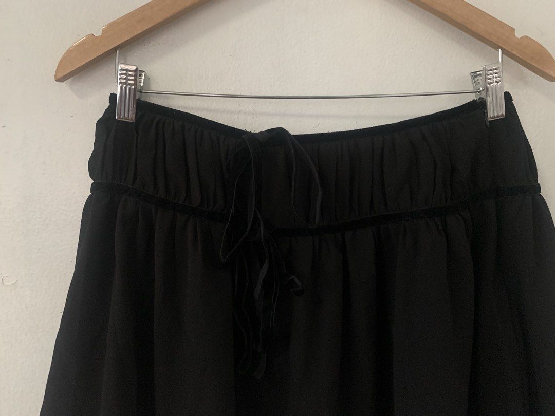 Black Mini Skirt with Drawstring Waist (Category: Skirts) located in Malabon City. Submitted by vewonica (Listing ID 1459956934, Image 2). Description: - Chic black mini skirt - Comfortable elasticated drawstring waist with elegant velvet trim - Flattering flowy hemline - Measurements (laid flat): Approx. 13 inches length, 31 inches waist - Ideal for everyday casual wear.