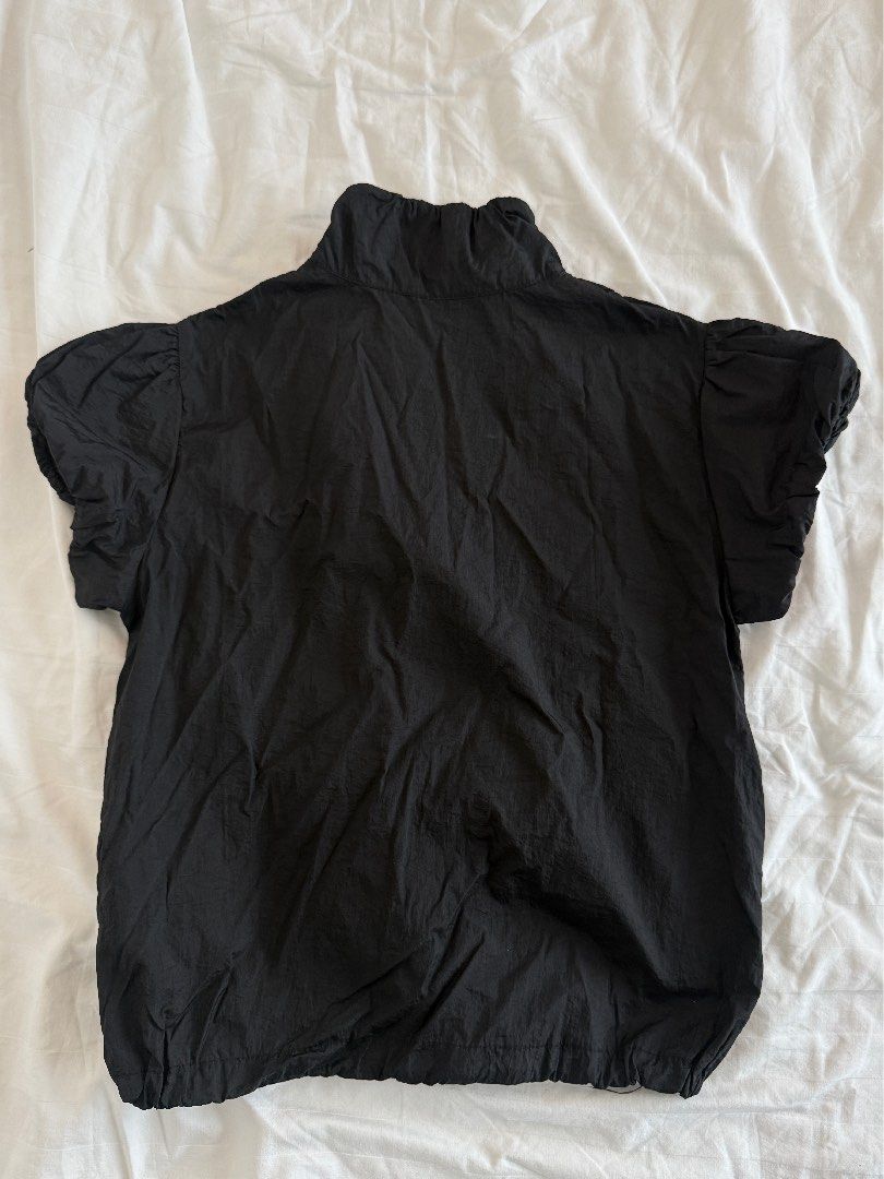 Black nylon zip up puff sleeve top (Category: Shirts) located in Mandaluyong City. Submitted by outofstoragewtf (Listing ID 1459992217, Image 2). Description: - size xs - bought from south korea - black nylon material - zip up detail - measurements on photos .