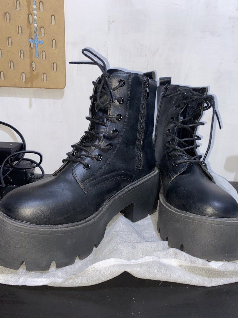 Black Platform Lace-Up Combat Boots (Category: Boots) located in Mandaluyong City. Submitted by jmashlozada323 (Listing ID 1460013275, Image 2). Description: - Chunky black platform boots - Size 37 - Lace-up front with convenient side zipper - Thick lug sole for added height and superior grip - Super edgy and cool, ideal for alt or streetwear outfits - Versatile: pairs well with jeans, skirts, or dresses Condition: Used once No box * see actual p