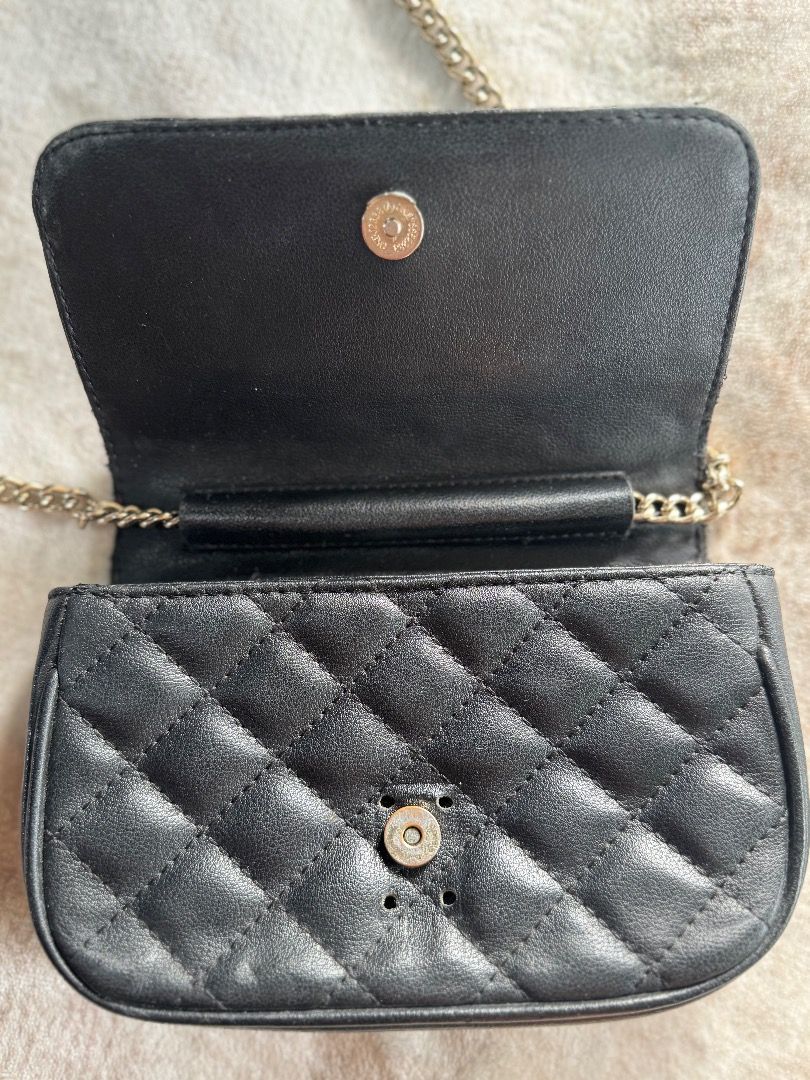 Black Quilted Chain Crossbody Bag (Category: Cross-body Bags) located in Caloocan City. Submitted by eogg30 (Listing ID 1460075321, Image 3). Description: - Cute black quilted bag - Silver chain strap - Small size, ideal for essentials - Magnetic snap closure - Subtle shimmer in material - Versatile for night outs or casual wear.