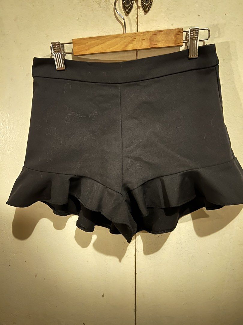 Black Ruffle Hem Shorts (Category: Shorts) located in Manila. Submitted by mkeconsil58884 (Listing ID 1460031265, Image 1). Description: - Cute black shorts - Ruffled hem detail - High-waisted style - Versatile: dress up or down - Easy to pair with any top - Perfect for summer outings or a night out.