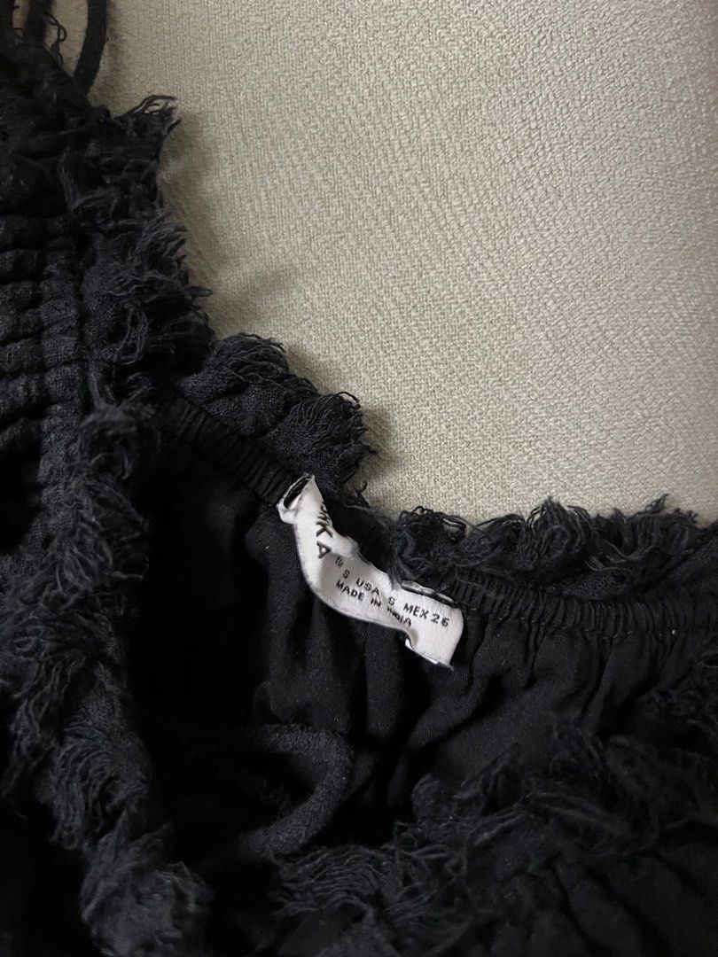 Black Ruffled Tiered Mini Dress with Tie Front (Category: Dresses) located in Paranaque City. Submitted by dubaichocolei (Listing ID 1460063254, Image 3). Description: - Black mini dress - Spaghetti straps - Ruffled neckline and hem - Smocked bust with tie detail - Tiered skirt design - Versatile for night out or casual wear.
