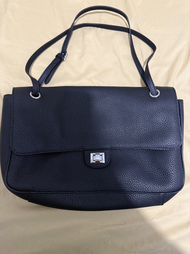 Black shoulder bag, leather, flap closure (Category: Shoulder Bags) located in Makati City. Submitted by kiratoby (Listing ID 1460043494, Image 1). Description: Black shoulder bag, clemence leather, flap closure, multiple inner pockets, silver hardware, 35” w 9”h.