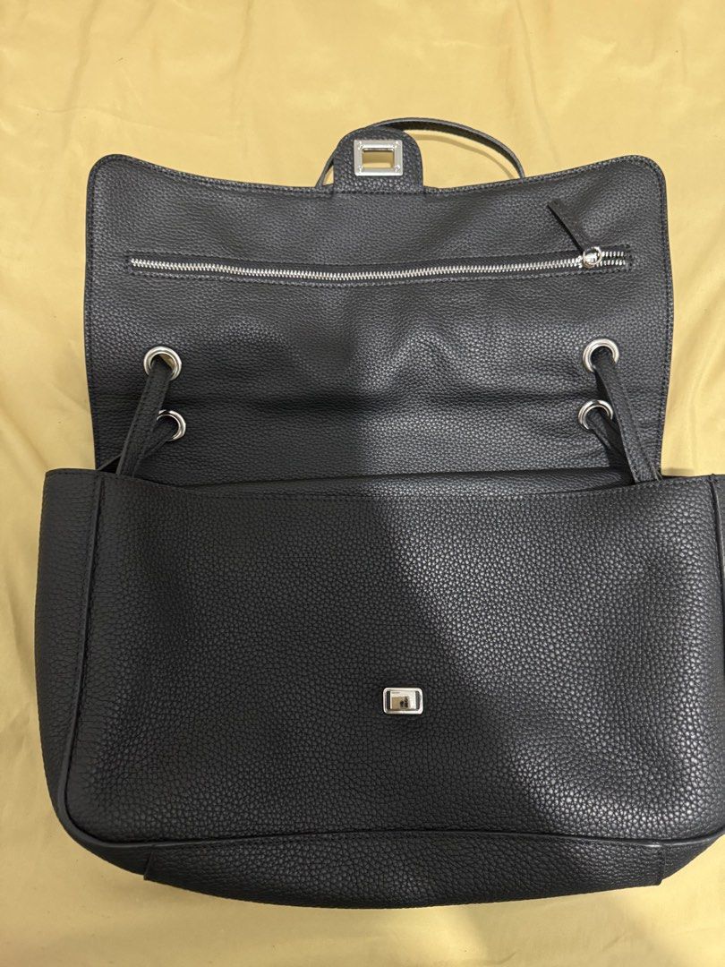 Black shoulder bag, leather, flap closure (Category: Shoulder Bags) located in Makati City. Submitted by kiratoby (Listing ID 1460043494, Image 2). Description: Black shoulder bag, clemence leather, flap closure, multiple inner pockets, silver hardware, 35” w 9”h.