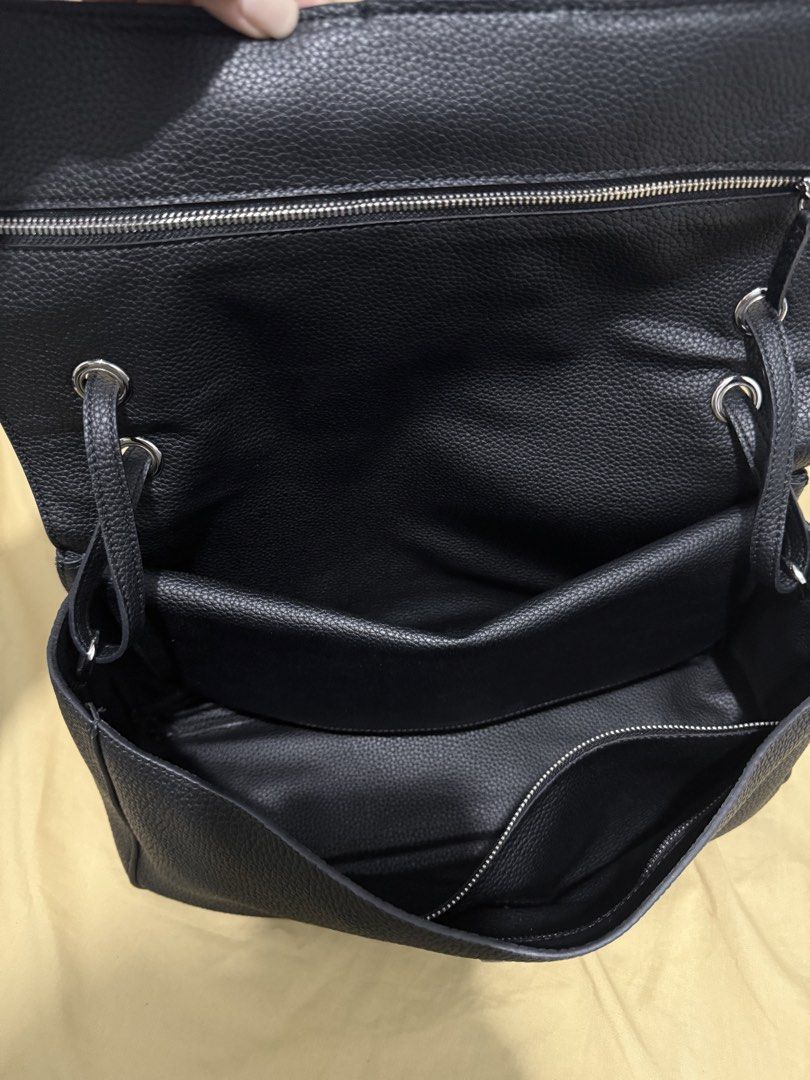 Black shoulder bag, leather, flap closure (Category: Shoulder Bags) located in Makati City. Submitted by kiratoby (Listing ID 1460043494, Image 3). Description: Black shoulder bag, clemence leather, flap closure, multiple inner pockets, silver hardware, 35” w 9”h.