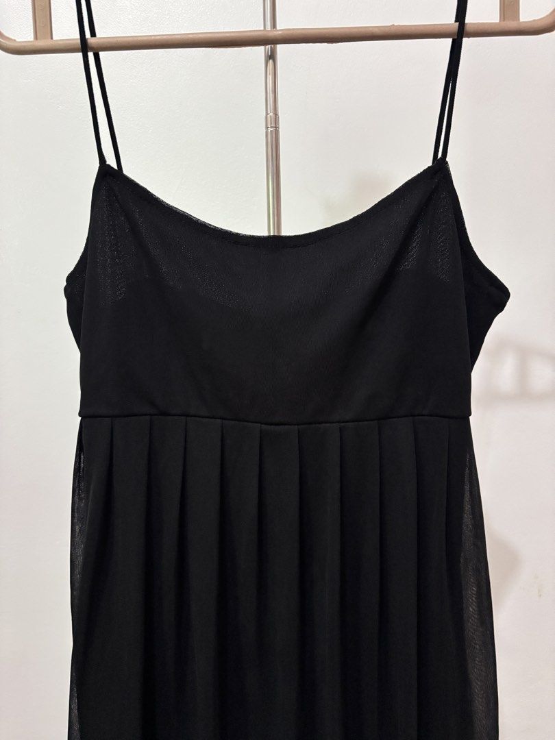 Black Spaghetti Strap Mesh Overlay Dress | Preloved (Category: Dresses) located in Taguig. Submitted by hi_itsziana (Listing ID 1459980884, Image 2). Description: - Spaghetti straps - Below the knee length - Flowy, pleated mesh skirt - Versatile: great for layering or wearing on its own - Simple and chic design.
