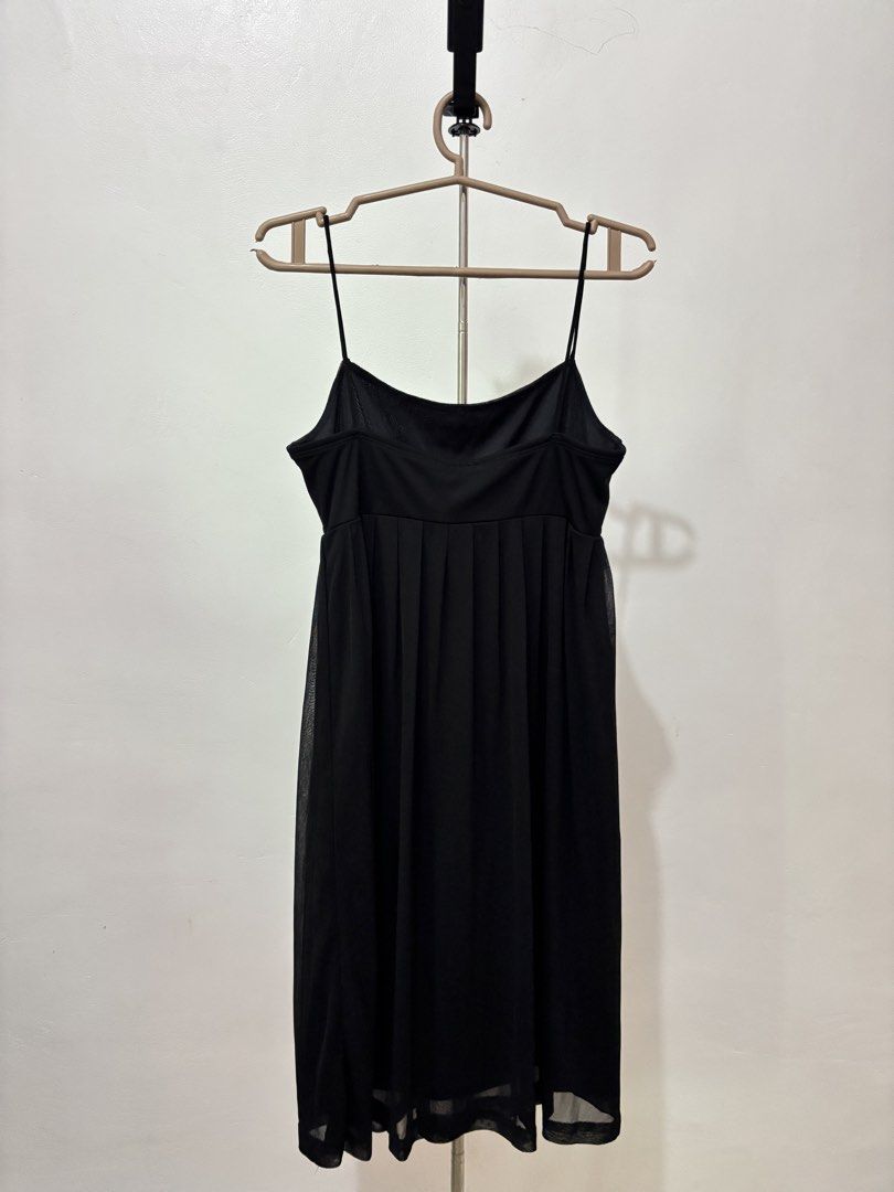 Black Spaghetti Strap Mesh Overlay Dress | Preloved (Category: Dresses) located in Taguig. Submitted by hi_itsziana (Listing ID 1459980884, Image 1). Description: - Spaghetti straps - Below the knee length - Flowy, pleated mesh skirt - Versatile: great for layering or wearing on its own - Simple and chic design.