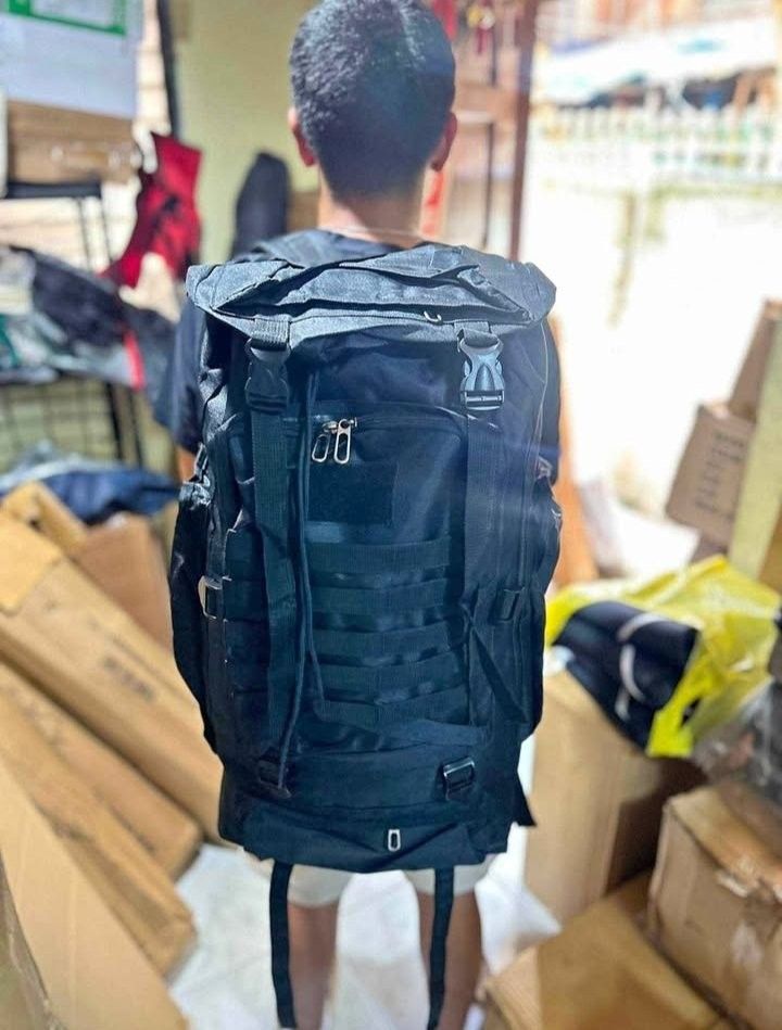 Black Tactical Backpack / Outdoor Hiking Backpack (Category: Backpacks) located in Manila. Submitted by zealdeer_5f4b49 (Listing ID 1460056365, Image 1). Description: - Large black backpack - Multiple compartments and pockets for organization - MOLLE webbing on front and sides for customizable gear attachment - Adjustable straps for a comfortable fit - Ideal for outdoor activities, travel, or everyday use - Made with durable material - Smooth wor