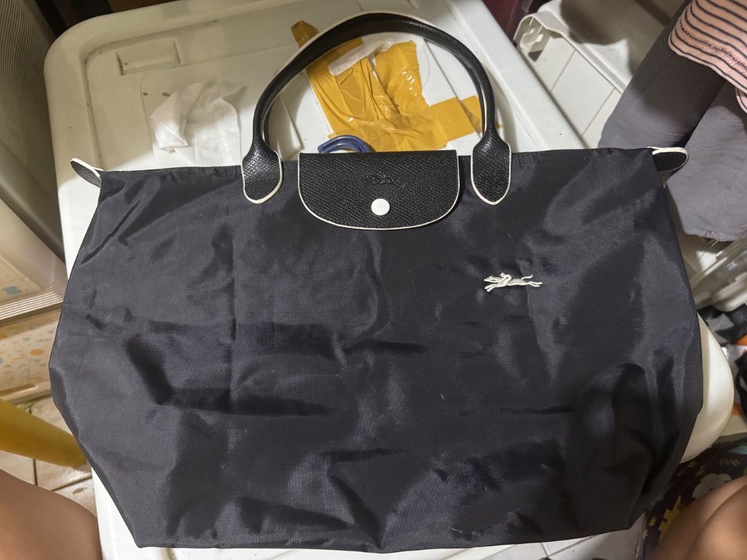 Black Tote Bag with Leather Accents (Category: Tote Bags) located in Quezon City. Submitted by littlemissshopper07 (Listing ID 1460007640, Image 2). Description: - Stylish black tote bag - Genuine leather handles and trim - Interior zippered pocket for secure storage - Ideal size for everyday use and carrying essentials good as new.
