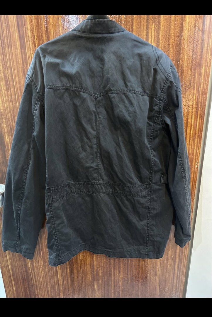 Black Utility Jacket with Multiple Pockets (Category: Coats, Jackets and Outerwear) located in Marikina City. Submitted by ek-goods (Listing ID 1460030366, Image 2). Description: - Stylish black utility jacket - Multiple front pockets, some with zippers for secure storage - Adjustable side straps for a customized fit - Ribbed detail on the collar for added texture - Ideal for everyday wear and outdoor activities - Measurements available upon requ