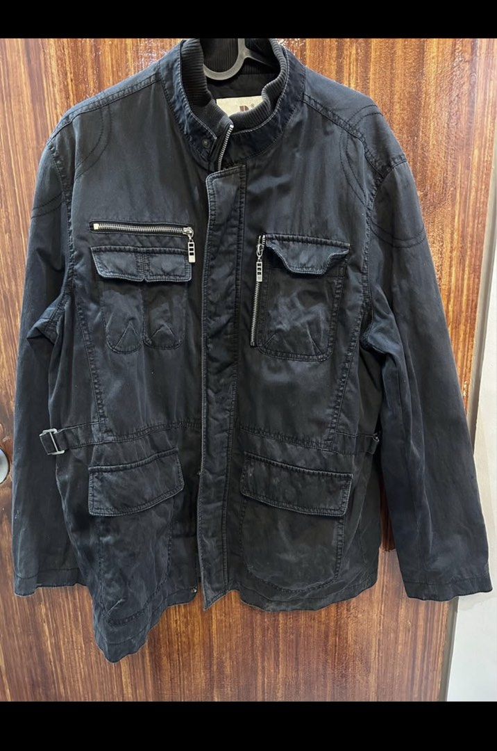 Black Utility Jacket with Multiple Pockets (Category: Coats, Jackets and Outerwear) located in Marikina City. Submitted by ek-goods (Listing ID 1460030366, Image 1). Description: - Stylish black utility jacket - Multiple front pockets, some with zippers for secure storage - Adjustable side straps for a customized fit - Ribbed detail on the collar for added texture - Ideal for everyday wear and outdoor activities - Measurements available upon requ