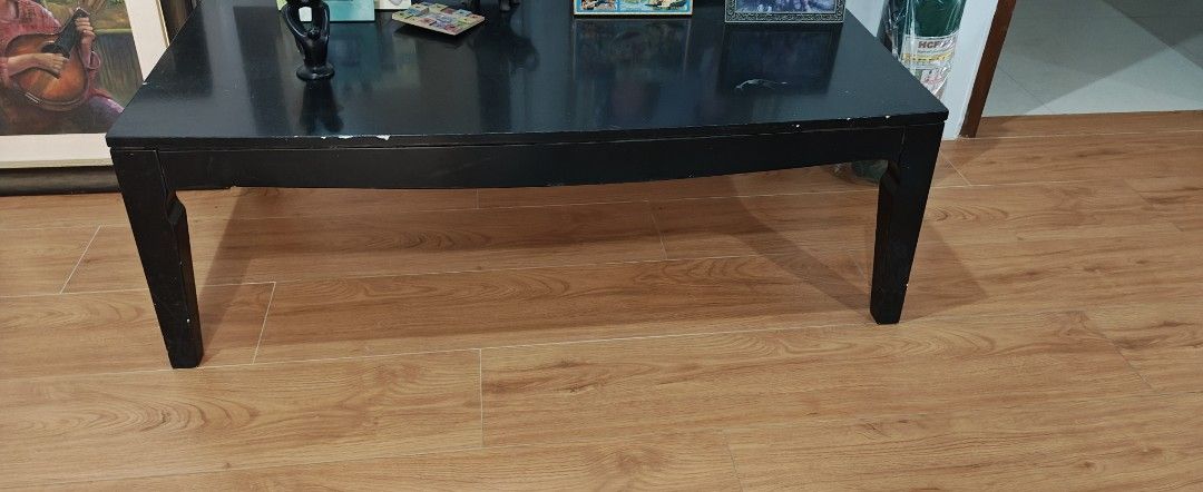 Black Wooden Coffee Table (Category: Tables & Sets) located in Manila. Submitted by teng_d (Listing ID 1459985584, Image 1). Description: - Simple black wooden coffee table. originally white,professionally painted to black - Minor chips and scuffs on edges (visible in photos) -fashionably curved legs, very stable - bought from good store in mall - Ideal for living room - Approximate dimensions: length: 110 cm ht: 38cm width:60 cm.