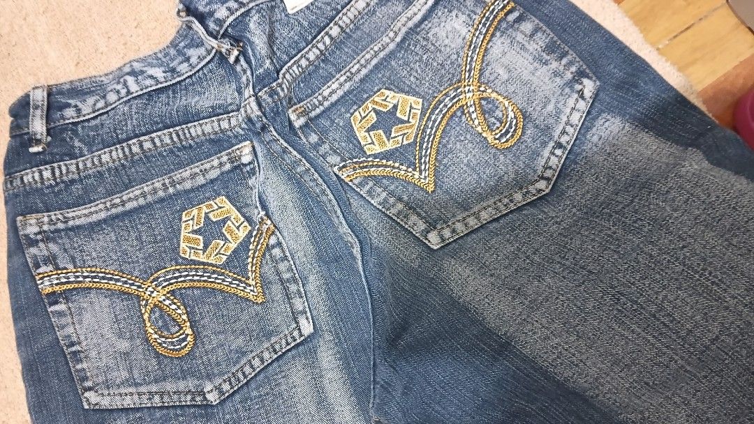 Blue Denim Jeans with Gold Embroidery (Category: Shorts) located in Muntinlupa City. Submitted by zlysiea (Listing ID 1459955174, Image 2). Description: - Classic blue denim jeans - Features stylish gold embroidery on back pockets - Traditional five-pocket styling - Secure button and zip closure - Designed for a comfortable fit - Ideal for casual everyday wear - Size 30 Waist.