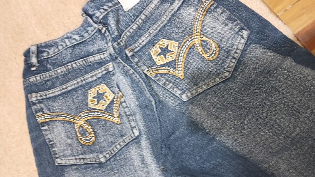 Blue Denim Jeans with Gold Embroidery (Category: Shorts) located in Muntinlupa City. Submitted by zlysiea (Listing ID 1459955174, Image 1). Description: - Classic blue denim jeans - Features stylish gold embroidery on back pockets - Traditional five-pocket styling - Secure button and zip closure - Designed for a comfortable fit - Ideal for casual everyday wear - Size 30 Waist.