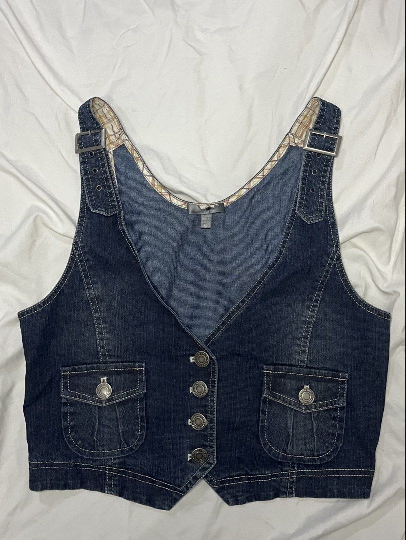 Blue Denim Vest with Buckle Straps and Pockets (Category: Vests) located in Midsayap. Submitted by ambsvnne (Listing ID 1460044009, Image 1). Description: - Cute blue denim vest - Adjustable buckle straps on shoulders - Two front pockets with button closures - Button-up front - Inner lining with plaid pattern - Versatile layering piece.