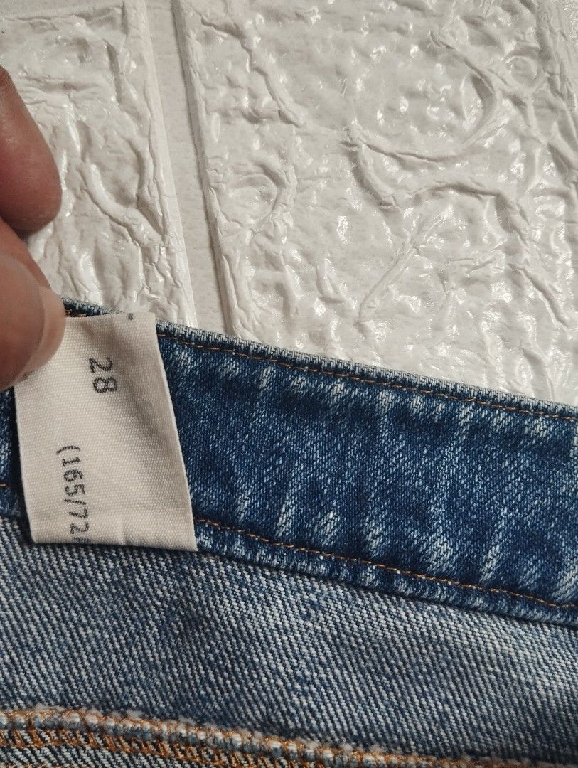 Blue Distressed Denim Shorts Size 28 (Category: Shorts) located in Dagupan City. Submitted by nahamul_1508 (Listing ID 1459999118, Image 3). Description: - Blue denim shorts - Distressed details with frayed hem - Button and zip closure - Two front pockets and two back pockets - Comfortable fit for casual wear - Ideal for summer outfits.