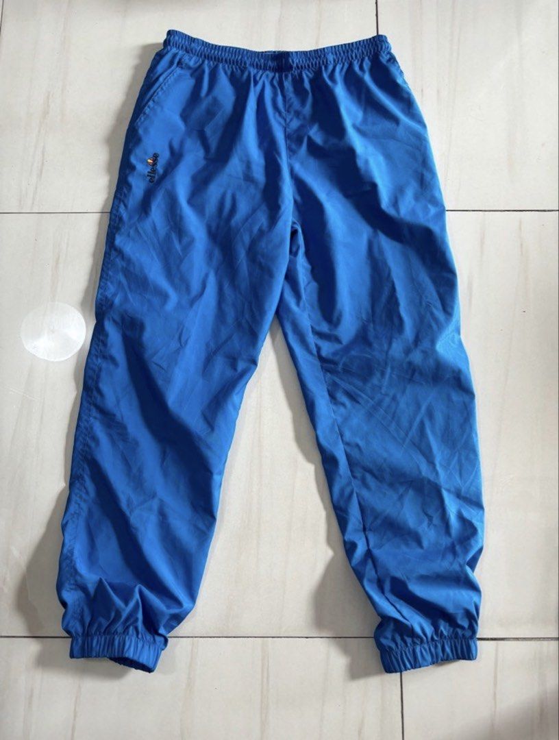 Blue Ellesse Track Pants Size S (Category: Joggers) located in Quezon City. Submitted by edether (Listing ID 1460011902, Image 1). Description: - Blue Ellesse track pants - Elastic waistband with drawstring - Cuffed ankles - Small embroidered Ellesse logo on left leg - Ideal for casual wear or sports Waist - 30-32in Length-37in If you see it posted, it’s available. Last price and details are posted. No reply means not interested. We are limited b