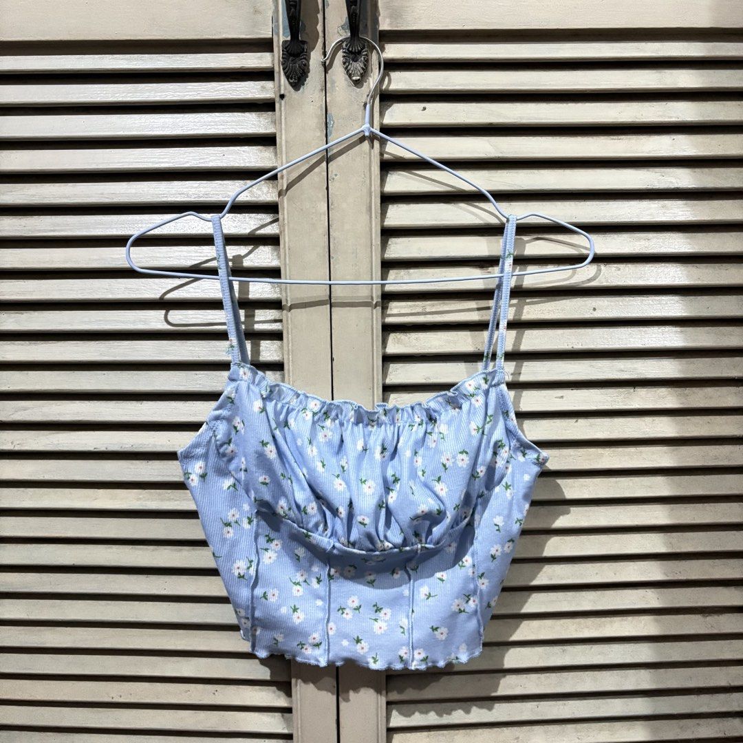 Blue Floral Corset Crop Top (Category: Others Tops) located in Marikina City. Submitted by senandash (Listing ID 1460045501, Image 1). Description: M - semi L - Cute blue and white pinstripe crop top - All-over floral print - Sweetheart neckline with ruched detailing - Adjustable spaghetti straps - Lettuce hemline - Pairs well with high-waisted jeans or skirts - Ideal for summer outings.