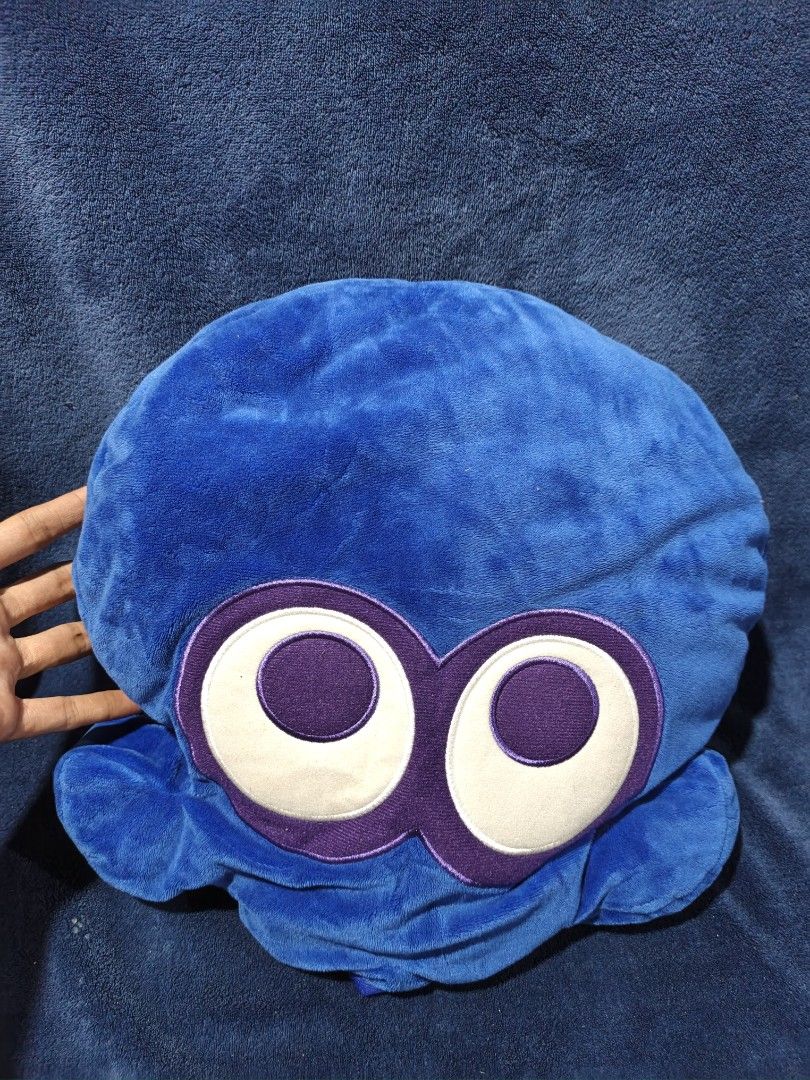 Blue Octopus Plush Toy (Category: Plushies & Soft Toys) located in Manila. Submitted by kirstentoyshub (Listing ID 1460005122, Image 1). Description: - Adorable blue plush toy - Features big white and purple eyes - Made with soft, touchable material - Ideal for decoration or as a cuddle companion.