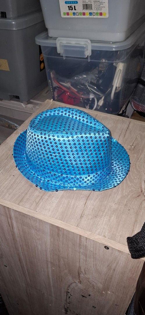 Blue Sequin Party Hat (Category: Hats & Beanies) located in Manila. Submitted by adaniel.81 (Listing ID 1460082705, Image 2). Description: - Fun blue hat covered in shiny sequins - Perfect for parties or costumes - Adds a pop of color to any outfit - One size fits most - Great for dress-up or a night out.
