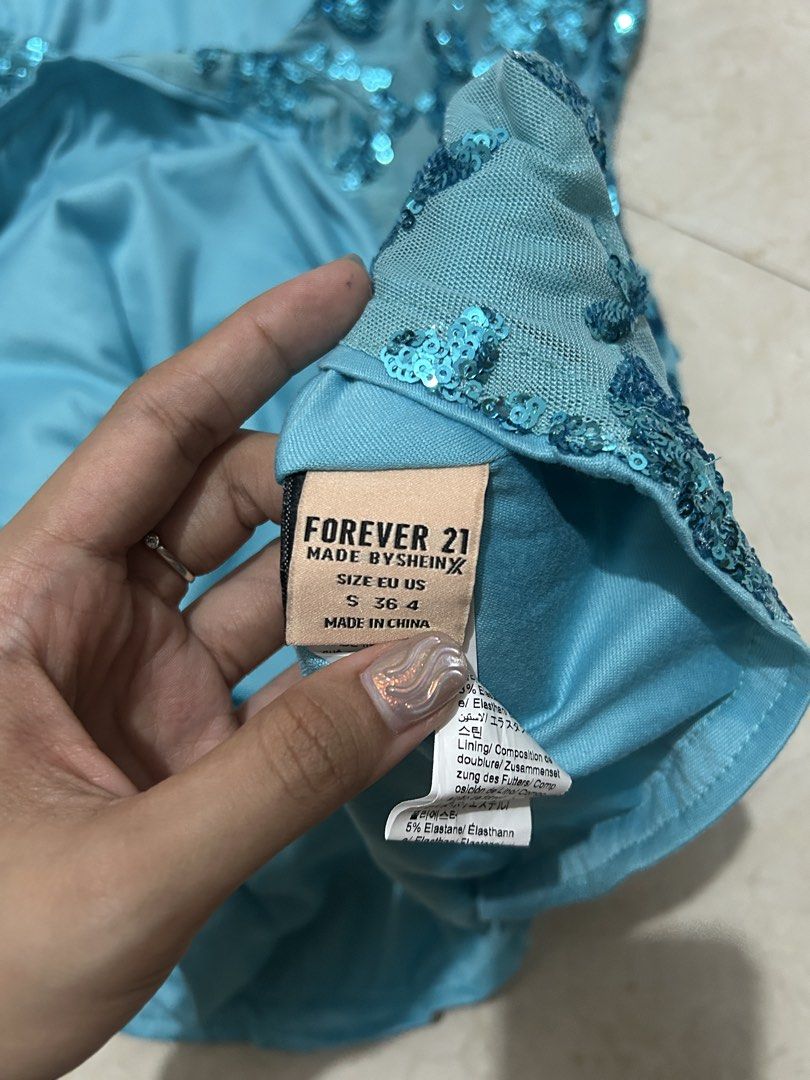 Blue Sequined Dress (Category: Dresses) located in Calamba. Submitted by thingsilovedd (Listing ID 1460053830, Image 3). Description: Small Size on Tag but kasya po hanggang Medium. I haven’t used this yet pero nalabhan na sya kaya like new parin condition. .