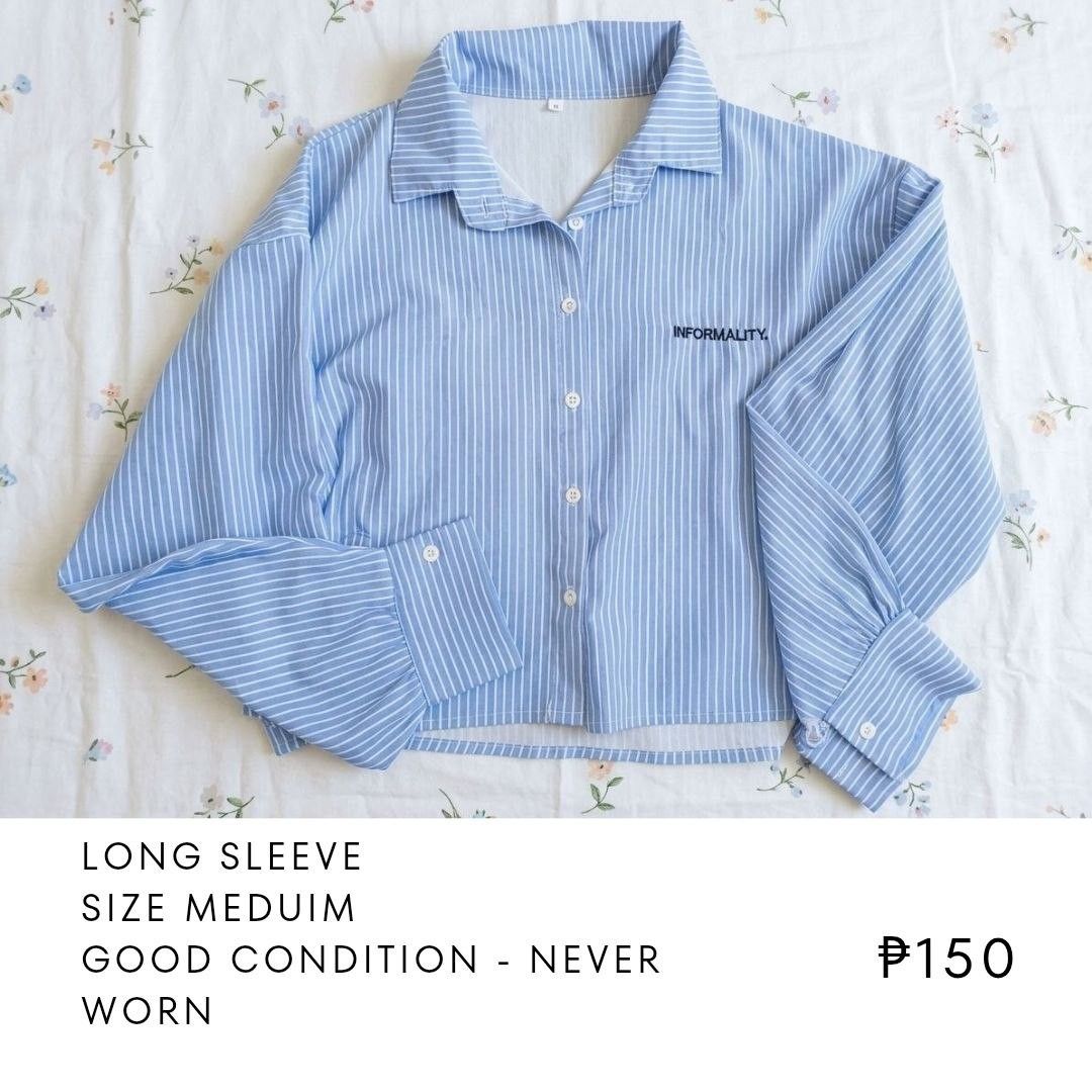 Blue Striped Long Sleeve Shirt with "INFORMALITY" Text (Category: Longsleeves) located in Manila. Submitted by thriftedbyclau (Listing ID 1460104782, Image 1). Description: - Light blue shirt with white vertical stripes - "INFORMALITY." embroidered on the chest - Long sleeves with buttoned cuffs - Cropped length - Ideal for a casual, chic outfit.