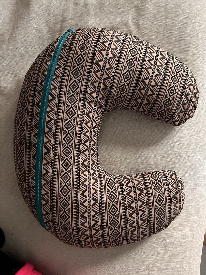 Boppy Nursing Pillow with Geometric Pattern (Category: Breastfeeding & Bottle Feeding) located in Taguig. Submitted by miel77 (Listing ID 1459988605, Image 3). Description: - Comfortable C-shaped nursing pillow - Fun geometric tribal print (black and tan) - Teal zipper for easy cover removal and washing - Plump and firm for excellent support - Ideal for feeding time for moms and babies - Additional 2 pillow cases - For pick up in Alabang Hills.