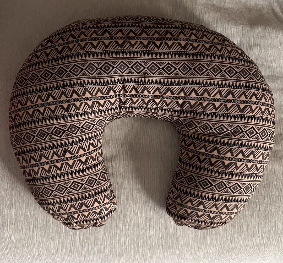 Boppy Nursing Pillow with Geometric Pattern (Category: Breastfeeding & Bottle Feeding) located in Taguig. Submitted by miel77 (Listing ID 1459988605, Image 1). Description: - Comfortable C-shaped nursing pillow - Fun geometric tribal print (black and tan) - Teal zipper for easy cover removal and washing - Plump and firm for excellent support - Ideal for feeding time for moms and babies - Additional 2 pillow cases - For pick up in Alabang Hills.
