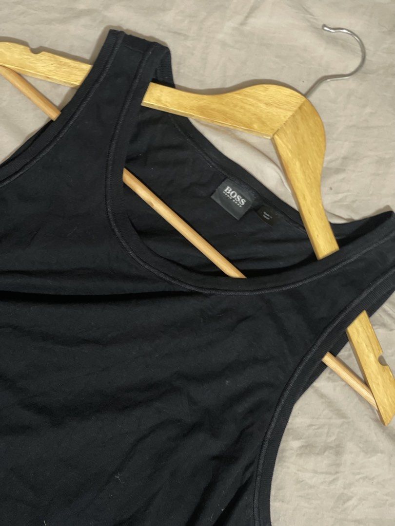 BOSS Hugo Boss Black Tank Top (Category: Sleep and Loungewear) located in Marikina City. Submitted by joshuaades21107 (Listing ID 1460084729, Image 2). Description: - Classic black BOSS Hugo Boss tank top - Simple and versatile design - Soft and comfortable material - Ideal for layering or wearing on its own - Features a subtly embroidered BOSS logo on the chest.