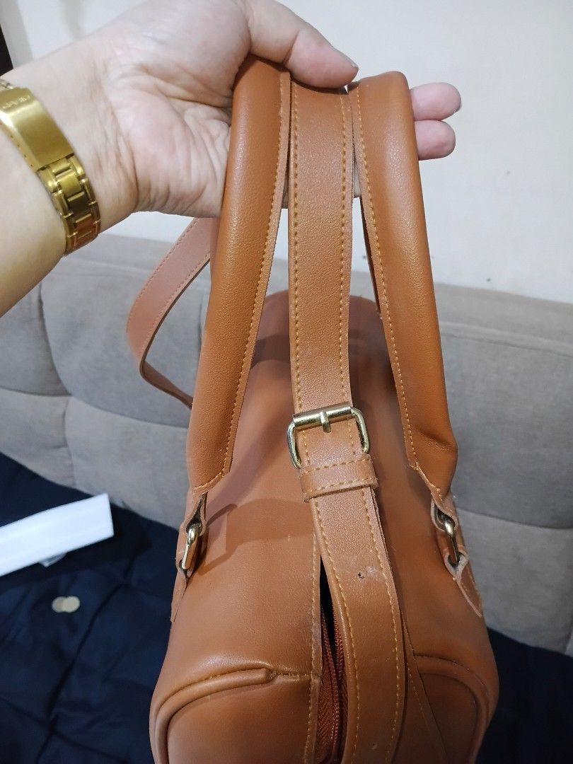 Boston Army Bag inspired (Category: Luxury Bags & Wallets) located in Cavite. Submitted by ms.de.clutter (Listing ID 1460043980, Image 2). Description: - Brown leather handbag - Versatile: top handles and detachable shoulder strap - Secure interior zippered pocket - Brand: ARMY (visible inside) - Ideal for everyday use.
