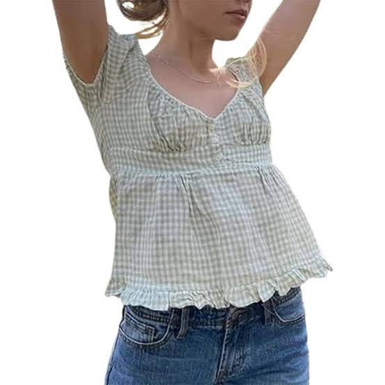 Brandy Melville Light Green Plaid Top (Category: Blouses) located in Manila. Submitted by prelovedshop0818 (Listing ID 1459926915, Image 2). Description: - Cute light green gingham fabric - Square neckline with white lace trim - Short puff sleeves - Button-up front - Smocked waist for a flattering fit - Ruffled hemline - Versatile for pairing with jeans or shorts - Ideal for a casual, summery look.