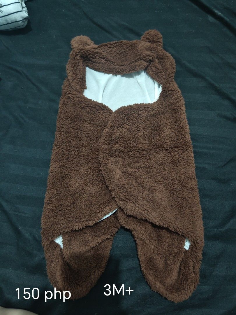 Brown Bear Swaddle for 2-3M Babies (Category: Babies & Kids Fashion) located in Manila. Submitted by nads.m (Listing ID 1459997454, Image 1). Description: - Super cozy brown bear swaddle - Soft and fluffy material for ultimate warmth - Adorable bear ears on the hood - Suitable for babies 2- 3 months - Easy to wrap your little one Never used.