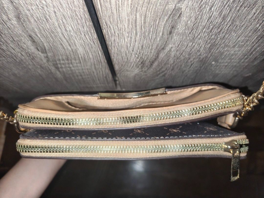 Brown Crossbody Bag with Gold Chain (Category: Cross-body Bags) located in Taguig. Submitted by regisme (Listing ID 1460095578, Image 3). Description: Unused crossbody bag 👜 - 2 zippers, 1 front pocket - leather with chain straps Price: P750 + Shipping Fee Payment: GCash / BPI.