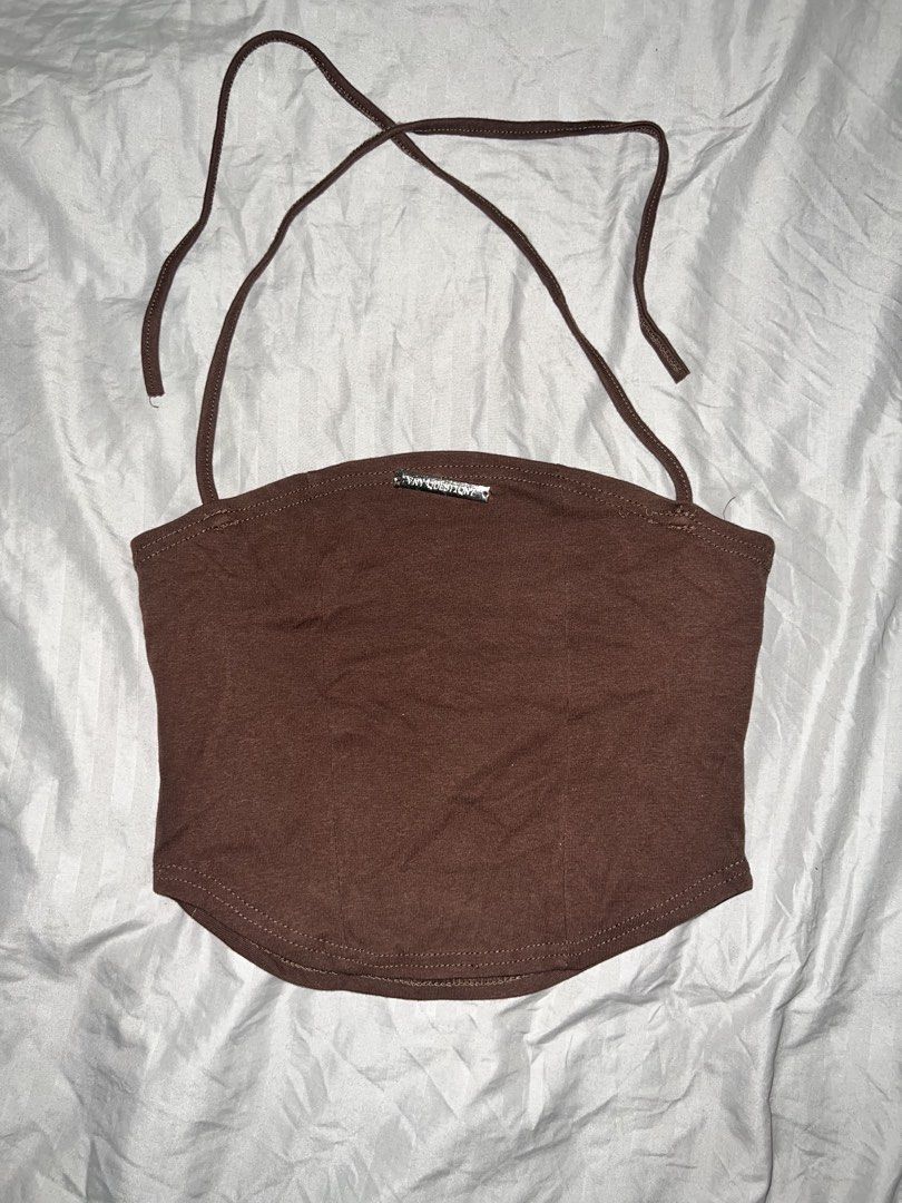Brown Halter Tube top with silver hardware (Category: Others Tops) located in Paranaque City. Submitted by michcianox (Listing ID 1460019231, Image 1). Description: Silver hardware detail on the chest saying “any question?” With minor flaw on the stitch XS to S Price does not include shipping fee can ship through lalamove 📍meet up location: SM Sucat 💵 payment through gcash/maya.
