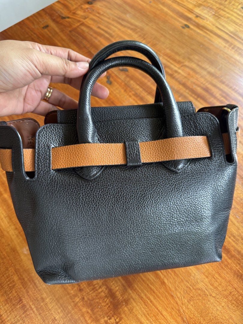 Burberry Leather Belt Sling (Category: Cross-body Bags) located in Cauayan City . Submitted by espiritucj (Listing ID 1459921147, Image 3). Description: 9”W x 7.5”H x 3”D 3” handle drop 19-21” Thrifted Minor rubs Replaced Sling.