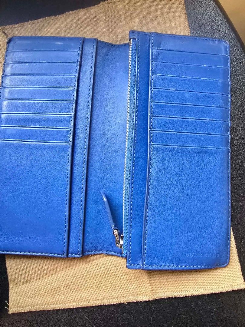 Authentic Burberry Long Wallet Blue Check Leather (Category: Luxury Bags & Wallets) located in Manila. Submitted by basicness (Listing ID 1459900437, Image 3). Description: - Authentic Burberry long wallet - Classic blue check exterior - Vibrant blue leather interior - Multiple card slots - Zippered compartment - Includes dust bag and authenticity cards - Perfect for organizing essentials NEGOTIABLE.