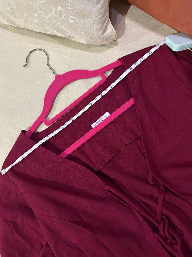 Burgundy Cropped Tie Blouse (Category: Blouses) located in Cainta. Submitted by unboxingstuff (Listing ID 1460048275, Image 2). Description: - Burgundy cropped top with ties - Short sleeves - Textured fabric; linen mix - Measurements: Approx. 15" chest, 17" length - Ideal for layering over tops or dresses.