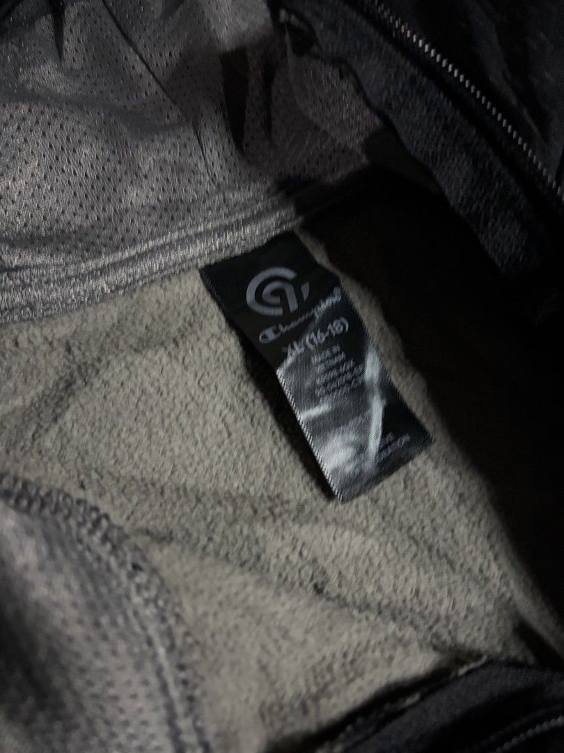 C9 Champion Black Full Zip Hoodie Jacket (Category: Coats, Jackets and Outerwear) located in San Jose. Submitted by rnb_thrift (Listing ID 1459930625, Image 2). Description: - Black Champion hoodie jacket - Size XL - Full zip closure - Chest pocket - Hooded design - Textured pattern on front chest - Ideal for workouts or casual wear.